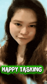 a picture of a woman with a happy tasking sticker on her face