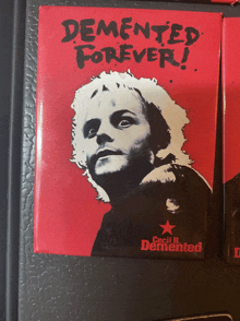 a red poster with a man on it that says " demented forever "