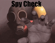 a person wearing a gas mask is holding a yellow ball .