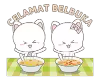 two cartoon cats are sitting at a table with bowls of food and the words " celamat belbuka " on the top