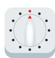 a white button with black circles and a red triangle in the middle