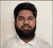 a man with a beard is wearing a white shirt with face app written on it