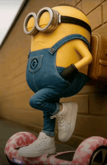 a minion wearing overalls and goggles is standing on a pink scooter