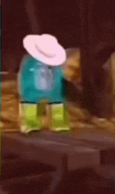 a gorilla wearing a white hat is sitting on a bed