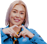 a woman making a heart shape with her hands wearing a blue shirt that says an