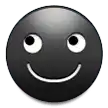 a black smiley face with a white smile on it .