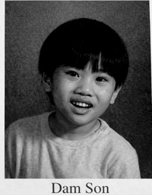 a black and white photo of a child with the name dam son