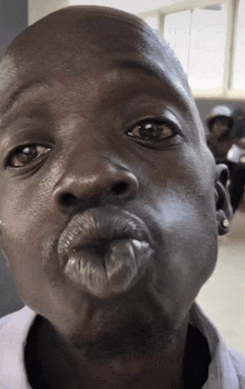 a close up of a man 's face with his mouth open