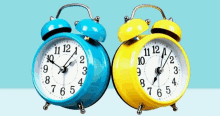 a blue and yellow alarm clock with the hands on the numbers 1 and 12