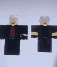 two roblox figures are standing next to each other