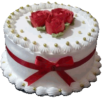 a white cake with three red roses and a red bow