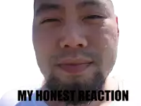 a close up of a man 's face with the words " my honest reaction " on the bottom