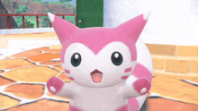 a pink and white animal with its mouth open