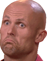 a close up of a bald man 's face with a surprised look on his face