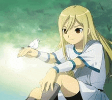 a blonde anime girl is sitting on the ground holding a small white bird in her hand .