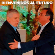 two men are shaking hands and the words bienvenidos al futuro are above them