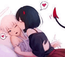 a couple of anime girls kissing each other on the cheek .