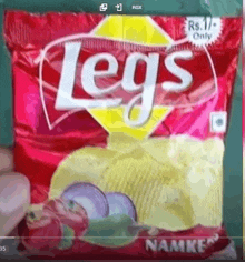 a bag of legs chips is sitting on a table