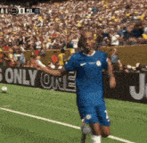 a soccer player on a field with a sign that says only one in the background