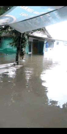 a flooded area with a sign that says ' jahil ' on it .