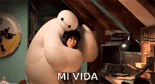 a cartoon character is hugging another cartoon character in a room with the words `` mi vida '' written on the bottom .