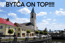 a picture of a clock tower with the words bytca on top