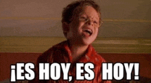 a young boy is making a funny face with the words `` es hoy , es hoy ! '' .