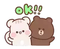 a brown bear and a white bear are standing next to each other with the word ok written above them