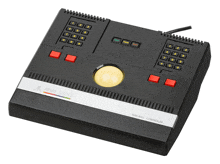 a black atari 3000 team ball controller with a yellow ball