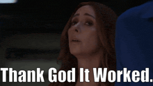 a woman says " thank god it worked " in front of a man in a blue suit