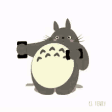 a cartoon totoro is taking a picture of himself with a cell phone .