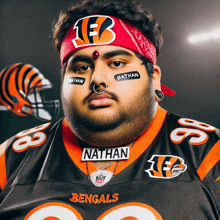 a man wearing a bengals jersey and a red headband