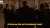 a group of men are standing in a room with plummeted written on the bottom