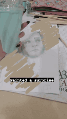 a person is holding a cup over a drawing of a woman with the caption painted a surprise