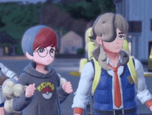 a boy wearing a pokemon shirt stands next to a girl with a backpack