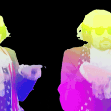 a man with a beard and sunglasses is standing next to a woman