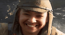 a close up of a man wearing a military hat and smiling .