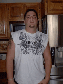 a man wearing a reflective shirt stands in front of a stainless steel refrigerator