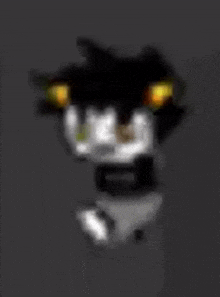 a blurry picture of a black and white cat with yellow eyes on a gray background .