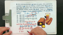 a clipboard with a math problem written in a language other than english