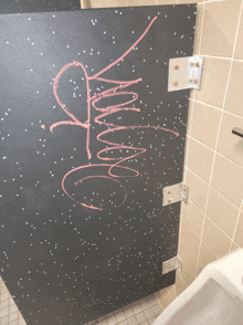 a bathroom stall with graffiti on it that says ' i love you '