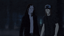 two men standing next to each other with one wearing a hat with a cat on it