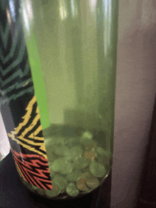 a bottle with coins in it has a label that says ' zebra ' on it