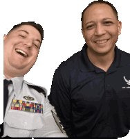 two men are posing for a picture with one wearing a u.s. air force polo shirt