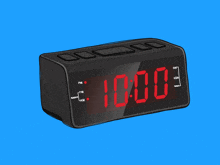 a black digital clock displays the time as 10:00