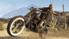 a man riding a motorcycle in the desert with a knife in his hand