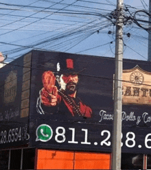 a large billboard with a cowboy holding a gun and the number 8112.8.6 on it