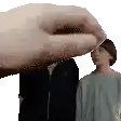 a hand is reaching out to touch a woman 's forehead .