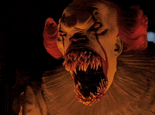 a close up of a clown 's face with blood on it 's face and red hair .