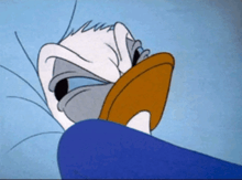 donald duck is laying in a bed with his head on a pillow
